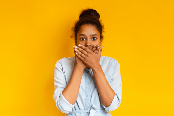 woman looking shocked