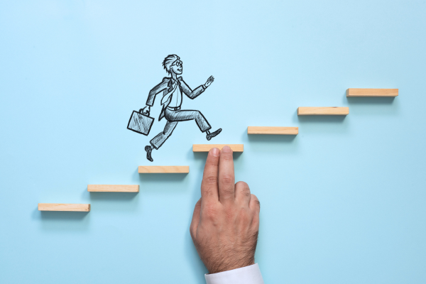 drawing of a man climbing up the stairs to success